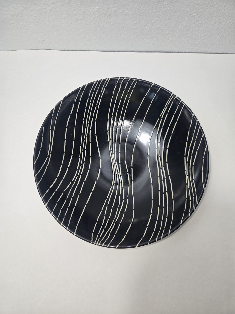 Modern Black Ceramic Wall Plate with White Linear Design
